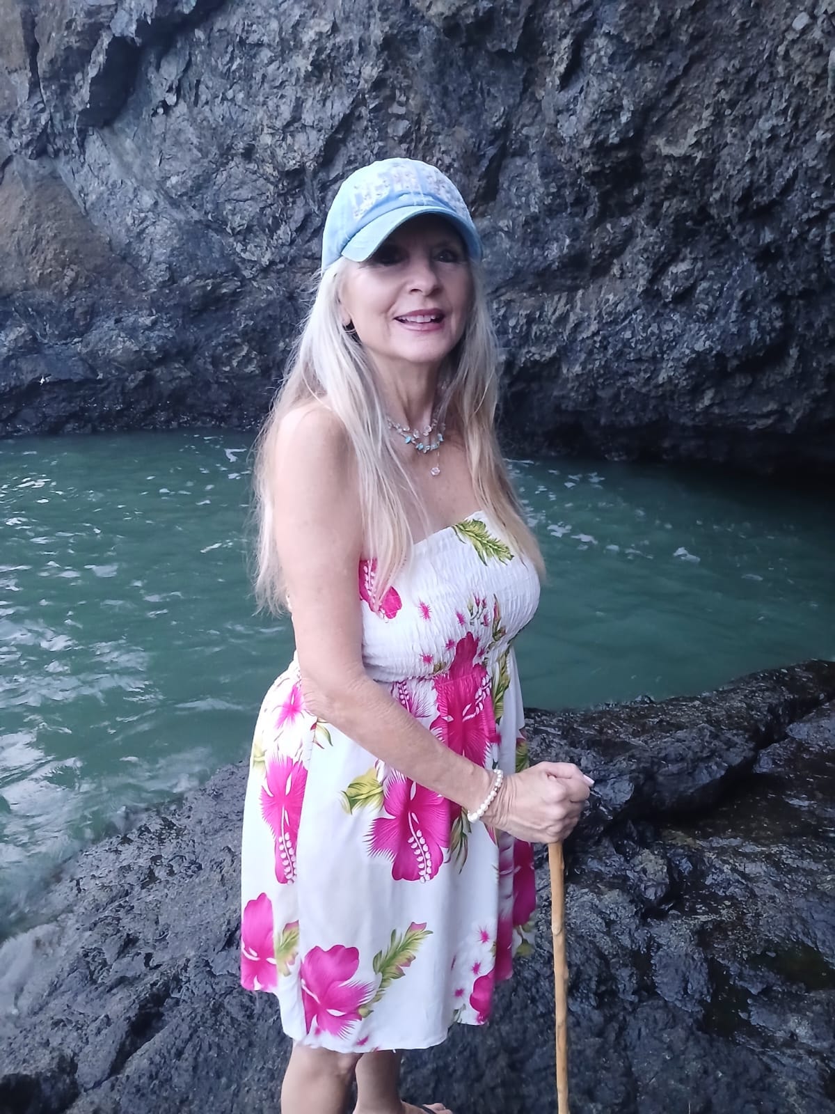 Cheryl Mansfield by the water with her dog